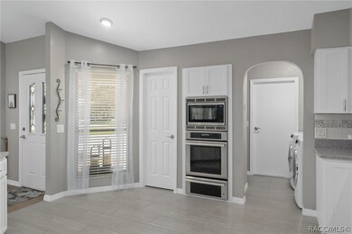 Kitchen View to Pantry, Laundry Room & Garage Acce