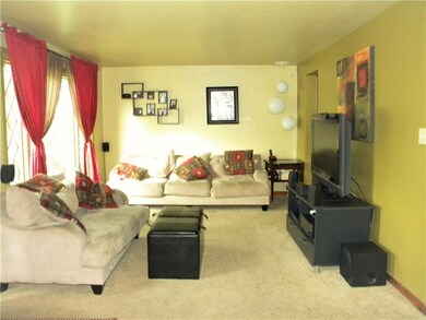 Large living room with a large window to let the l
