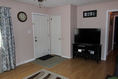 The home opens to the spacious living room.
