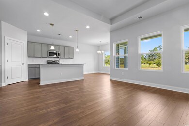 Kitchen featuring a kitchen island, gray cabinetry