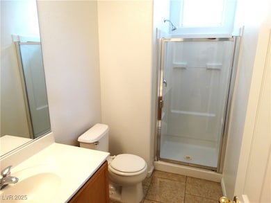 Bathroom featuring tile patterned floors, toilet,