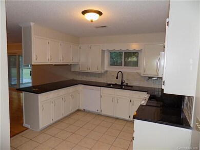 Kitchen - Tile Floor and Granite Countertop.