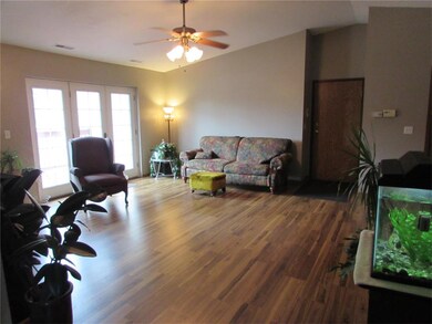 Vaulted great room with french door to relaxing de