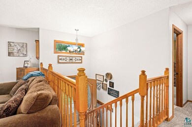 Interior space featuring a chandelier, a textured 
