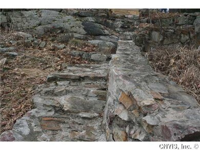 Exterior Front Strone walkway with many small perr