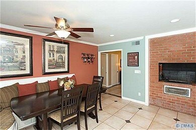 Breakfast nook opens to kitchen and opens to backy