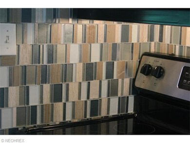Glass tile backsplash rounds out the kitchen updat
