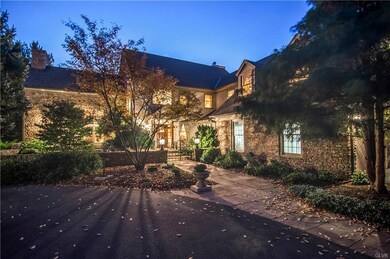Front of home at twilight w/custom outdoor lightin