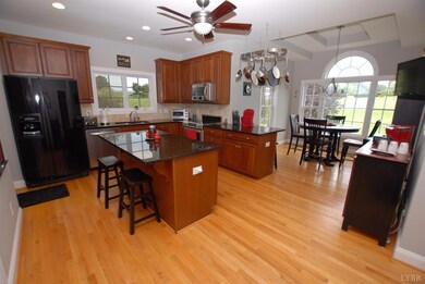 Kitchen opens up into bright sunny eating area wit