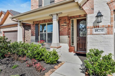 Welcome home! The charming front porch with a smart doorbell is beautiful for welcoming guests into your new home.