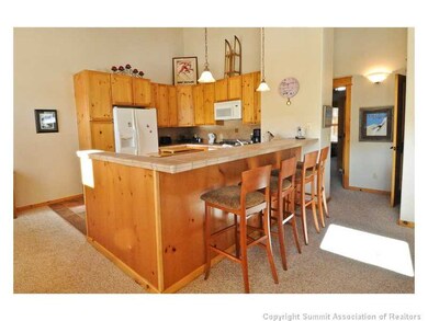 Kitchen. Extra seating at the bar area offers plen