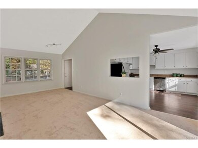 The great room opens to the foyer with a coat clos