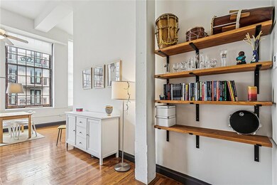 As you walk in, you'll find GLEAMING wood floors, 14-ft ceilings, and massive windows. The tasteful furnishings add a personal touch as well as additional storage for your needs.