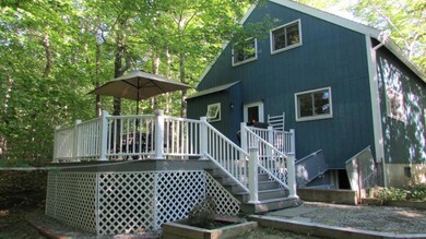 Rear view of home with new deck,...