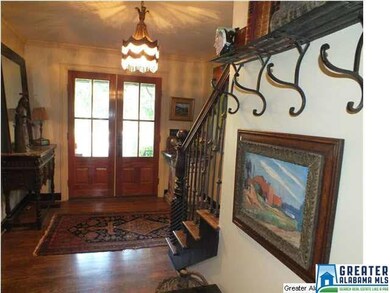The welcoming entry foyer has hardwood flooring an