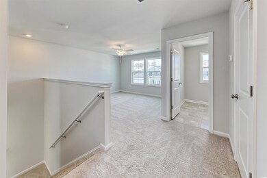 Hallway with light carpet
