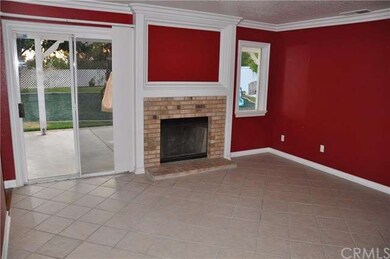 Family room has wood burning burning fireplace and