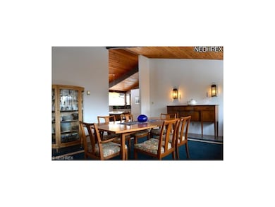 Dining room opens to kitchen and large screened po