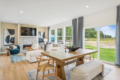 (Photo of model home, finishes will vary) Situated in front of glass sliders, this nook provides a perfect place for sun-dappled meals that can venture out to the backyard.