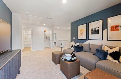 Living room featuring attic access, light colored carpet, recessed lighting, and baseboards