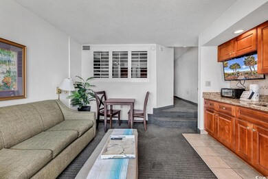 Living room featuring light tile patterned floors,