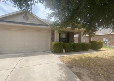 View of front of house with an attached garage, d