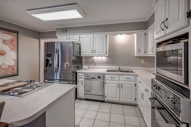 Painted cabinets, JennAir appliances and 5x3 islan