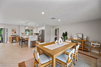 Dining space featuring recessed lighting and light wood-style floors