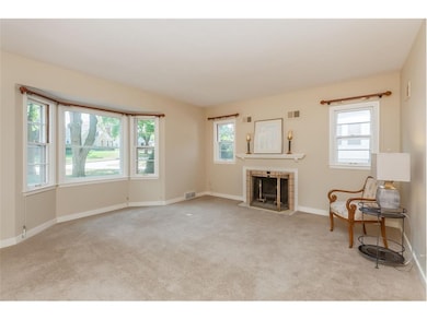 Bright living room with wood burning fireplace