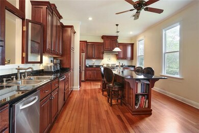Gourmet kitchen features 5 burner gas cook top wit