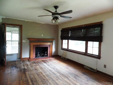 Living Room with hardwood floors, ceiling fan & fi
