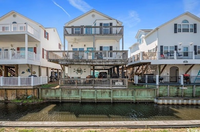 Back of property with a water view
