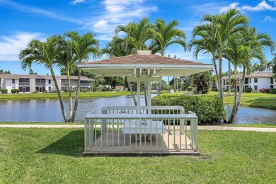 Surrounding community with a gazebo, a yard, and a water view