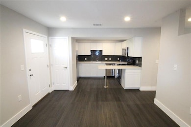 Kitchen featuring stainless steel microwave, visi