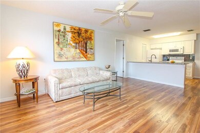 Open living area with beautiful flooring throughou