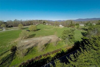 House and barn are sited at top of a gently slopin
