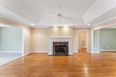 Living Room includes a large gas fireplace, with the dining room on one side, and a spacious Florida room on the other. Living room is also open into the kitchen.