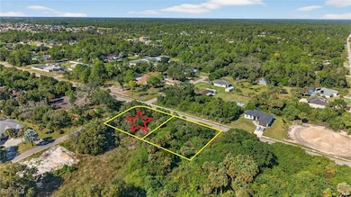 Aerial view of property's location with property boundaries highlighted and a forest