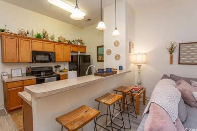 Kitchen featuring light countertops, a peninsula, 
