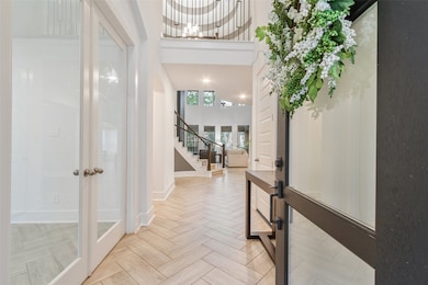 This inviting entryway features elegant herringbon