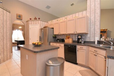 kitchen with island looks into family room