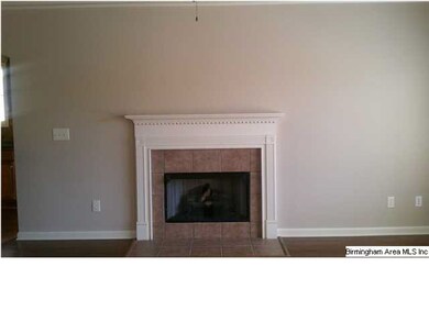 View of fireplace located in family room.
