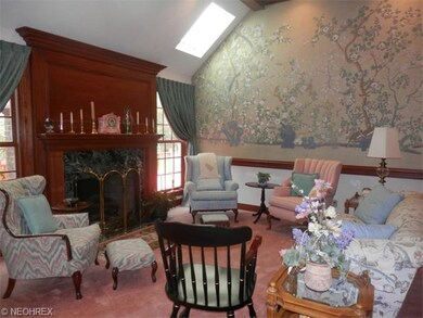 Great room with vaulted ceiling grand fireplace, a