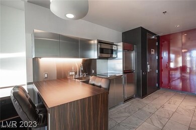 Kitchen with marble finish floor, stainless steel