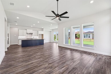 Unfurnished living room featuring dark wood-type 