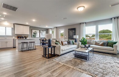 Gathering room with view of kitchen and dining are