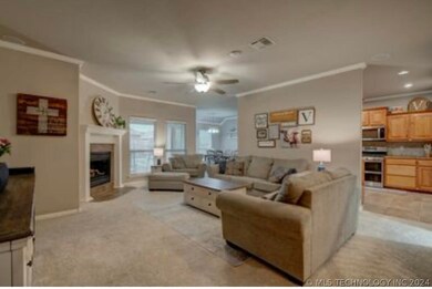 Gas fireplace, windows overlooking covered patio
