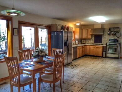Eat-in kitchen with door to deck.