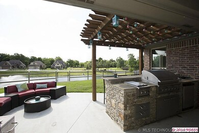 Covered patio + pergola extension has stone anchor