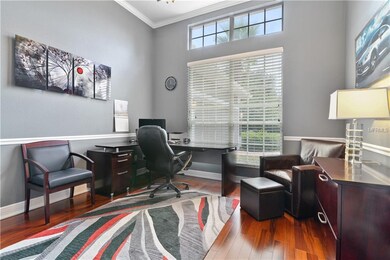 Office with crown molding and chair railing lookin